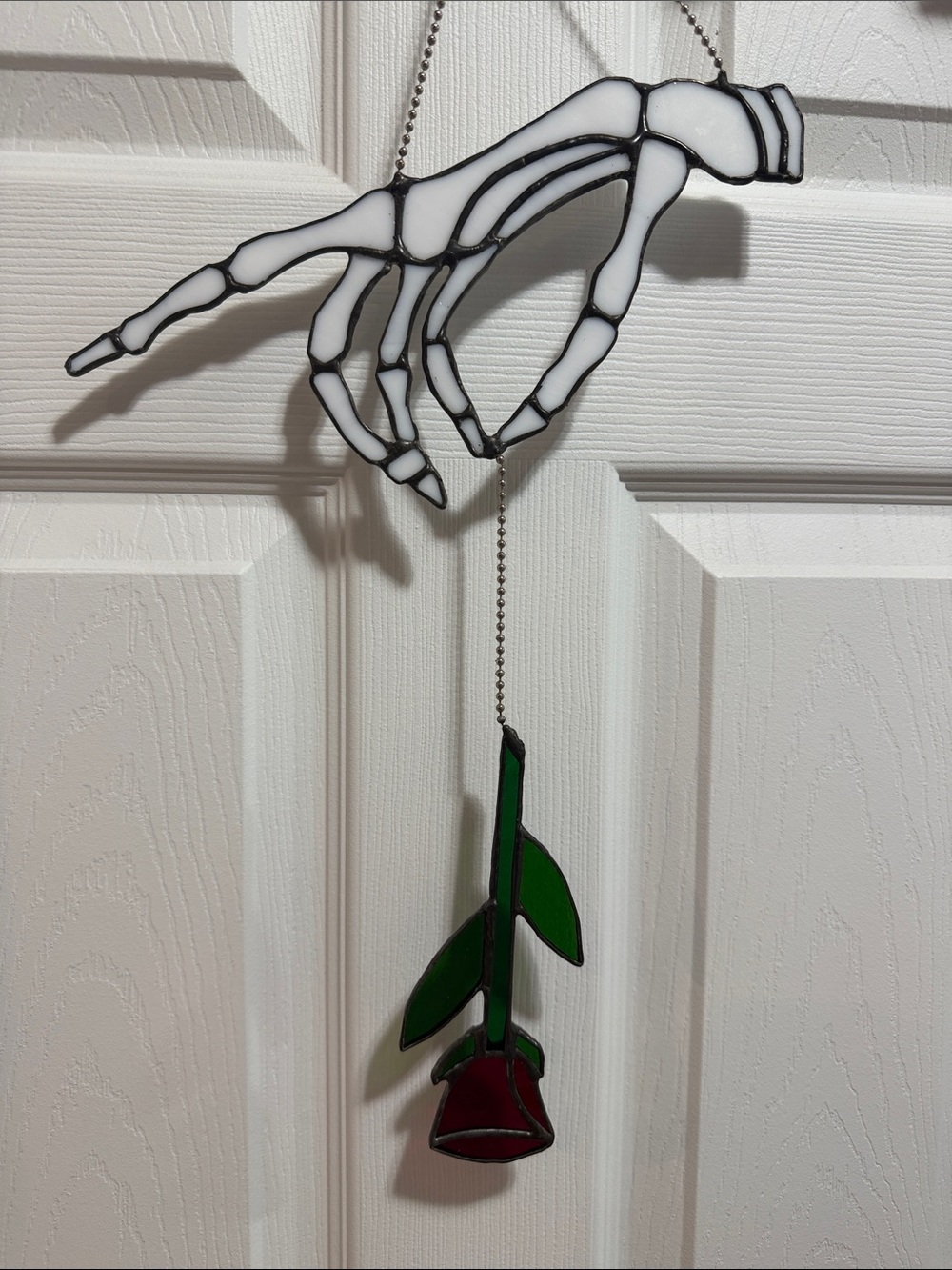 Stained Glass Skeleton Hand With Red Rose